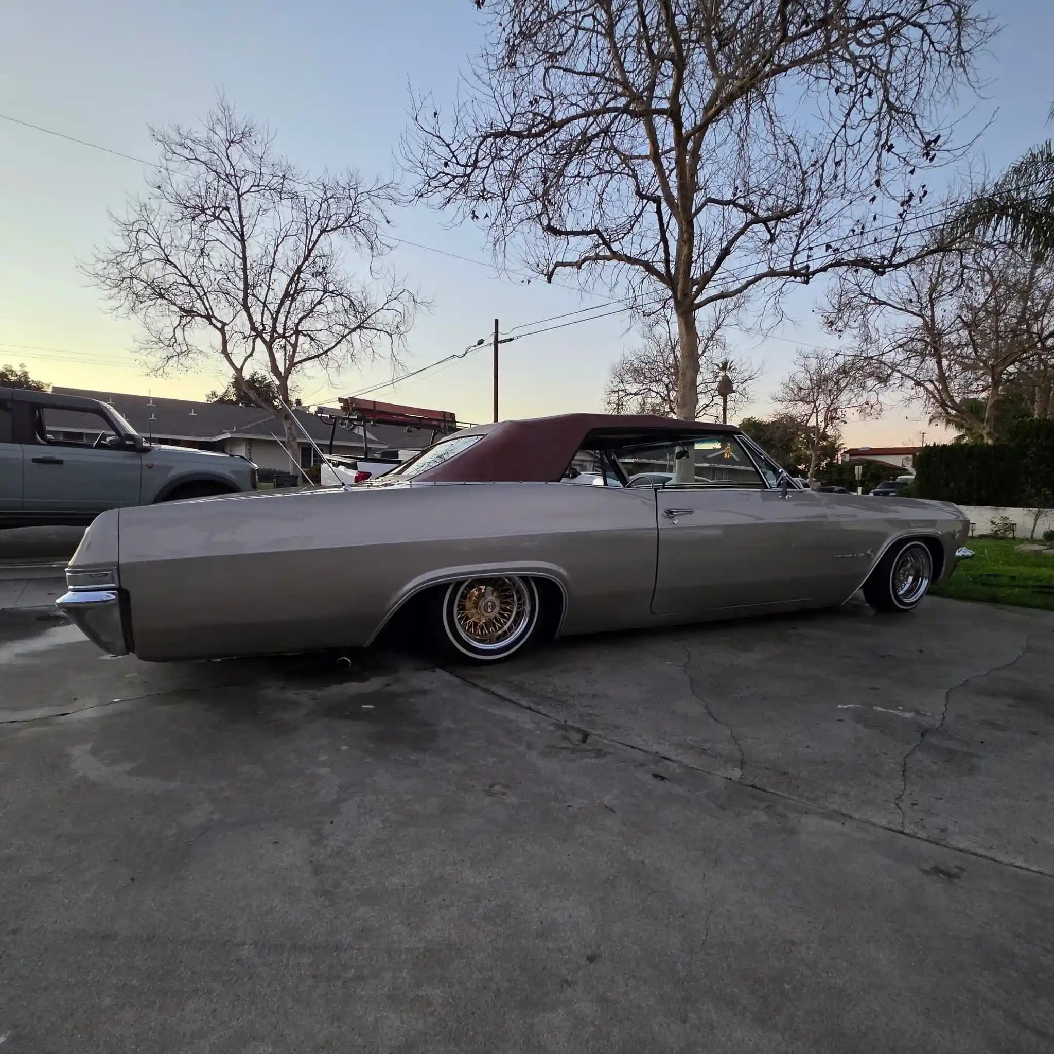 Side profile of the lowrider outdoors at dusk after detailing